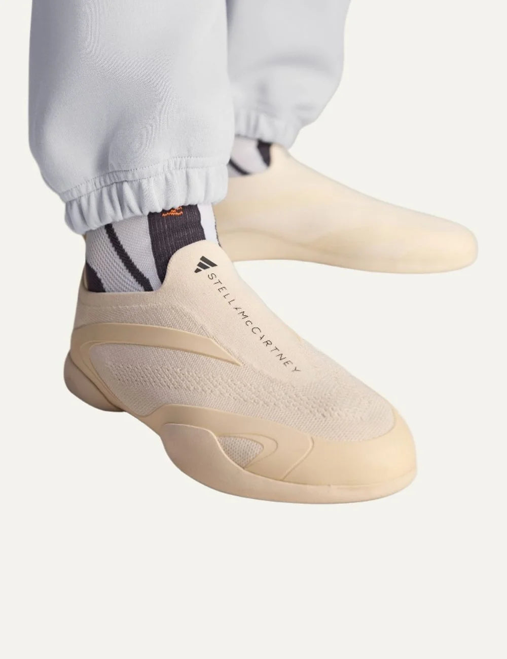 Adidas by Stella McCartney Taekwondo beige slip-on sneakers with breathable knit upper, curved side overlays and low-profile rubber sole model