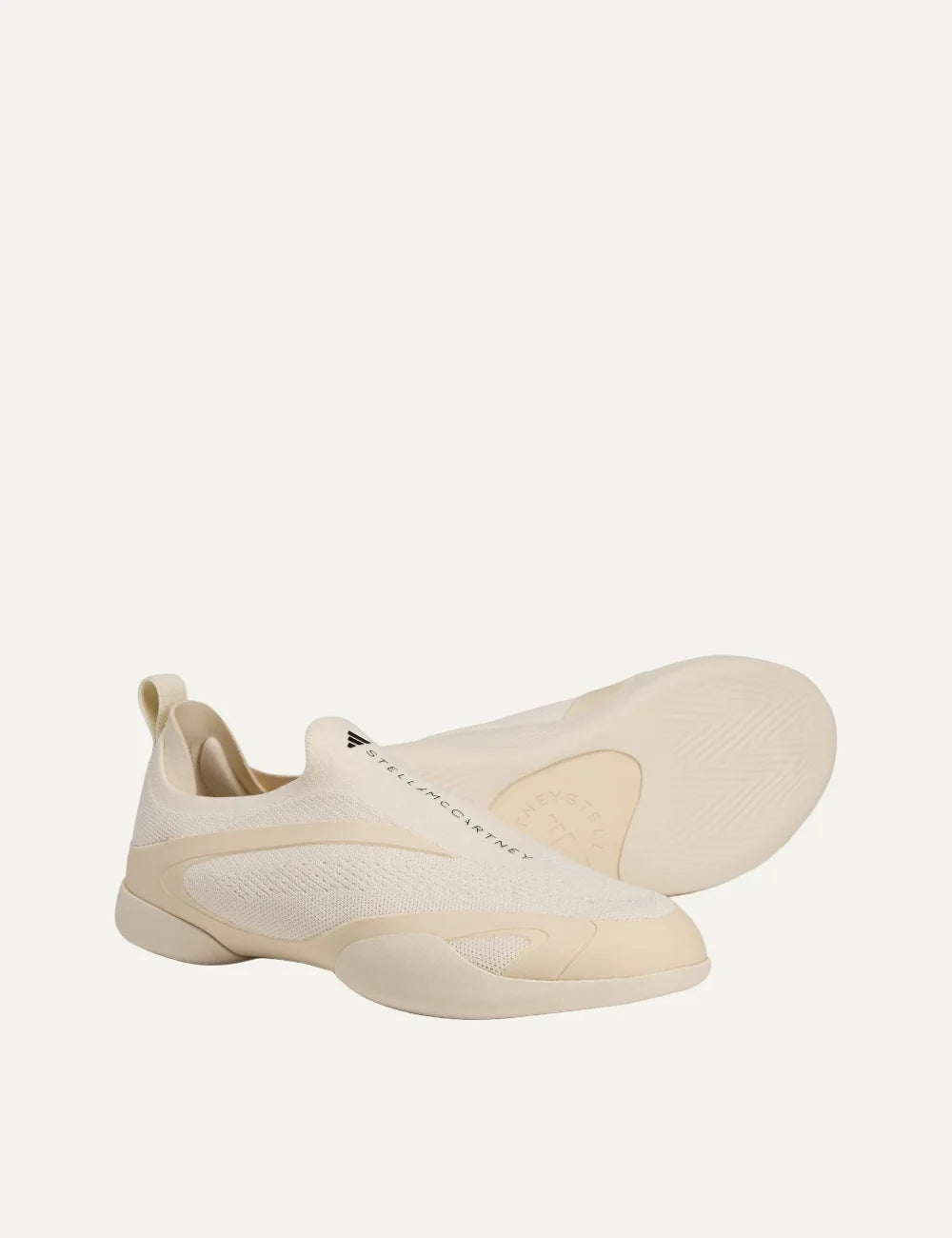 Adidas by Stella McCartney Taekwondo beige slip-on sneakers with breathable knit upper, curved side overlays and low-profile rubber sole top