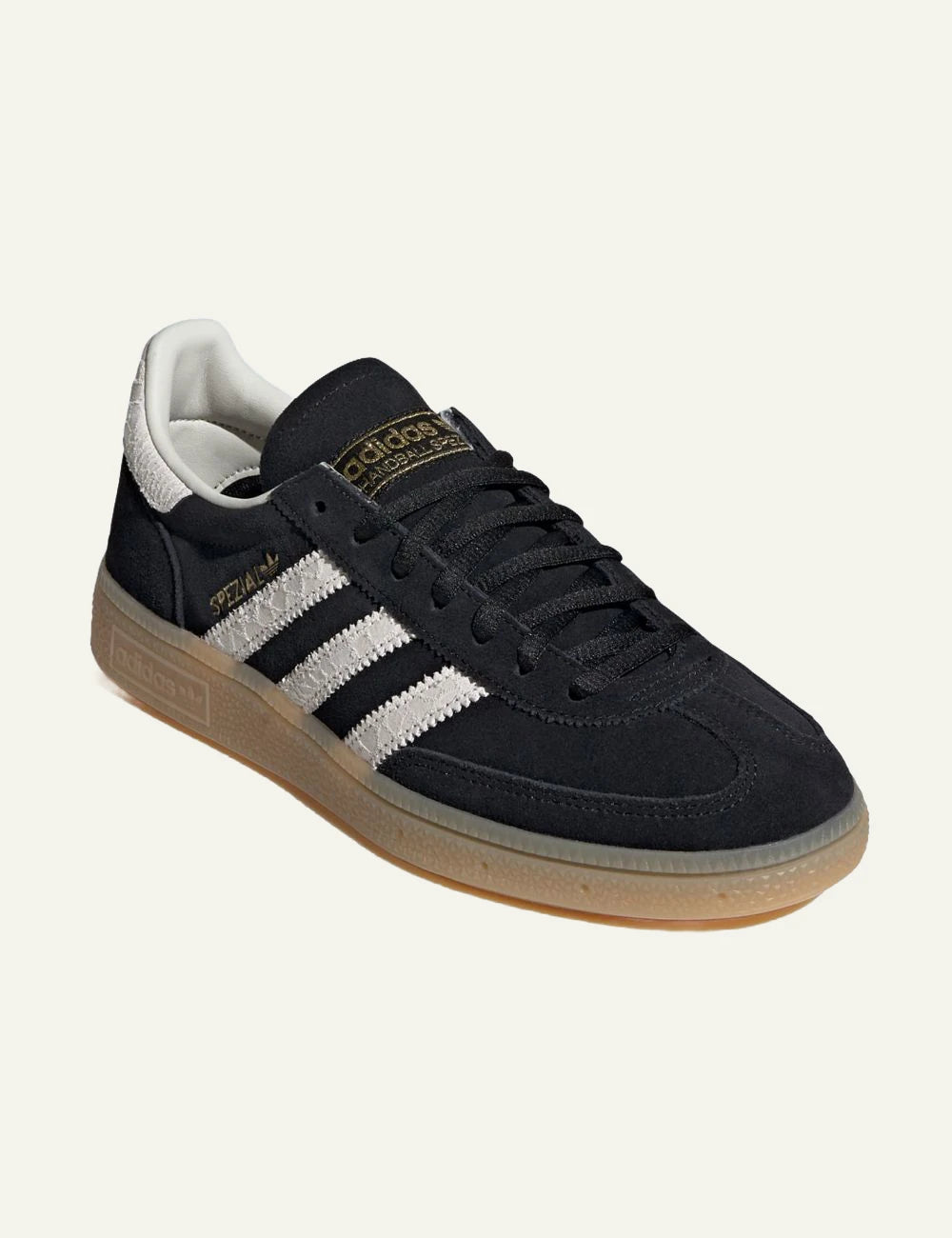 Adidas Handball Spezial black leather sneakers white stripes angled view
