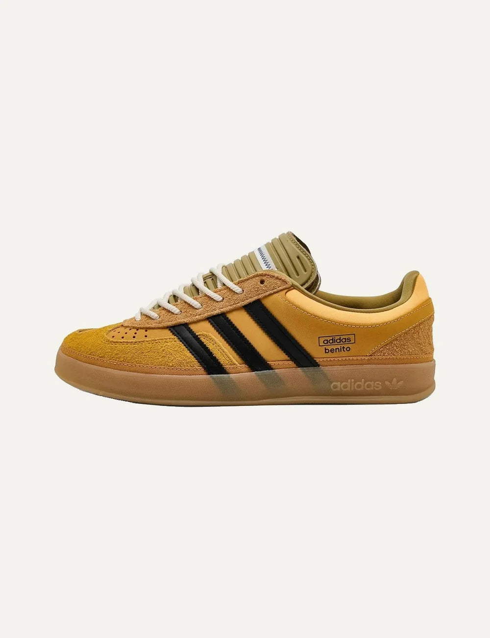 Bad Bunny x Adidas men's Gazelle Indoor sneakers in solar gold suede and leather with black stripes and gum sole profile