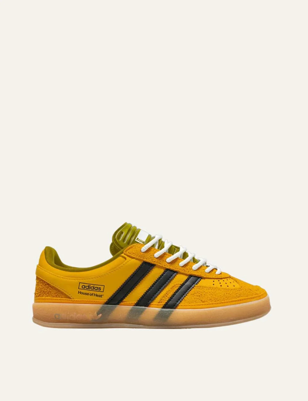 Bad Bunny x Adidas men's Gazelle Indoor sneakers in solar gold suede and leather with black stripes and gum sole.