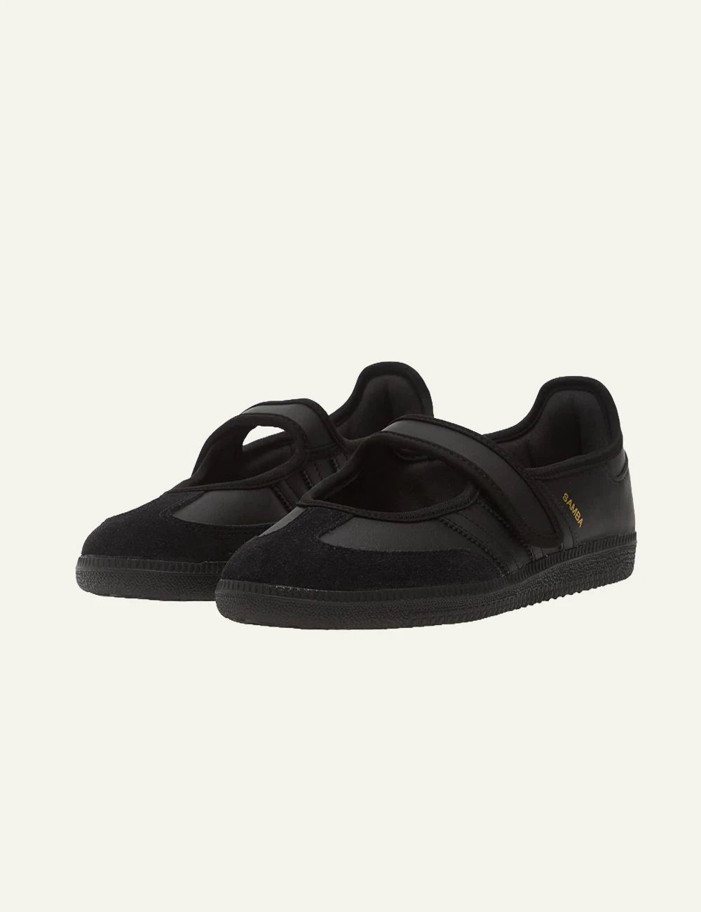 Adidas Originals black leather and suede slip on sneakers angled