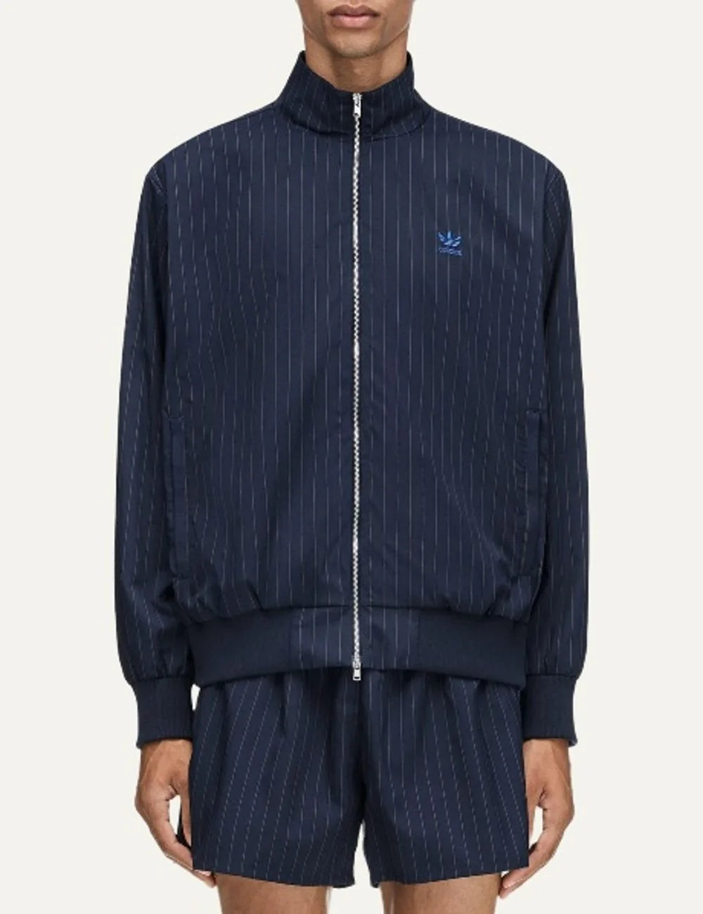 Men's Adidas Originals x Wales Bonner navy blue pinstripe track jacket with stand collar, blue Trefoil logo and front zip closure, front view