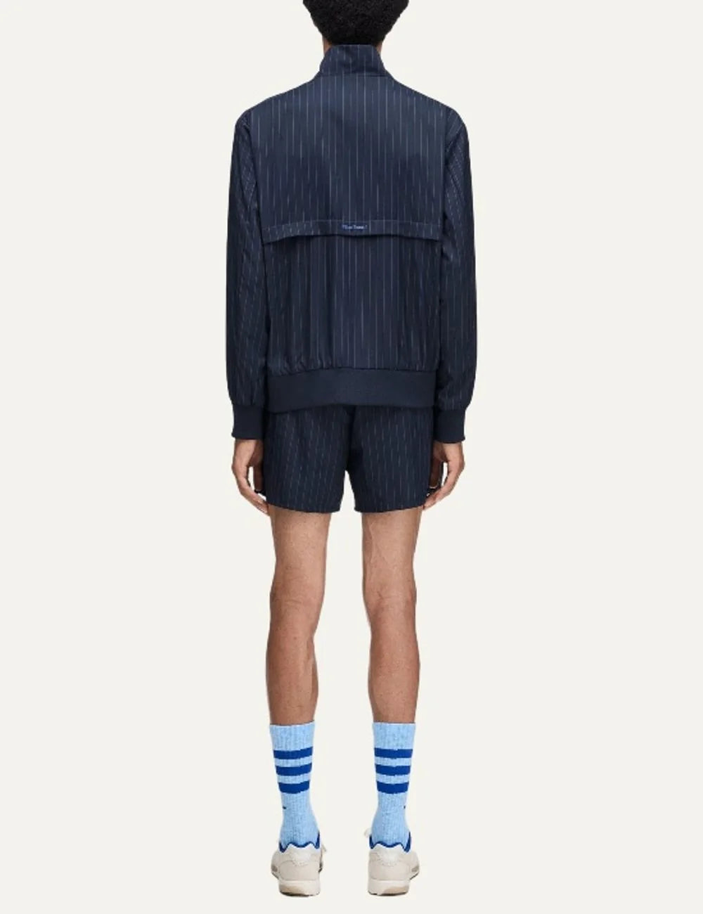 Men's Adidas Originals x Wales Bonner navy blue pinstripe track jacket with stand collar, blue Trefoil logo and front zip closure, back view