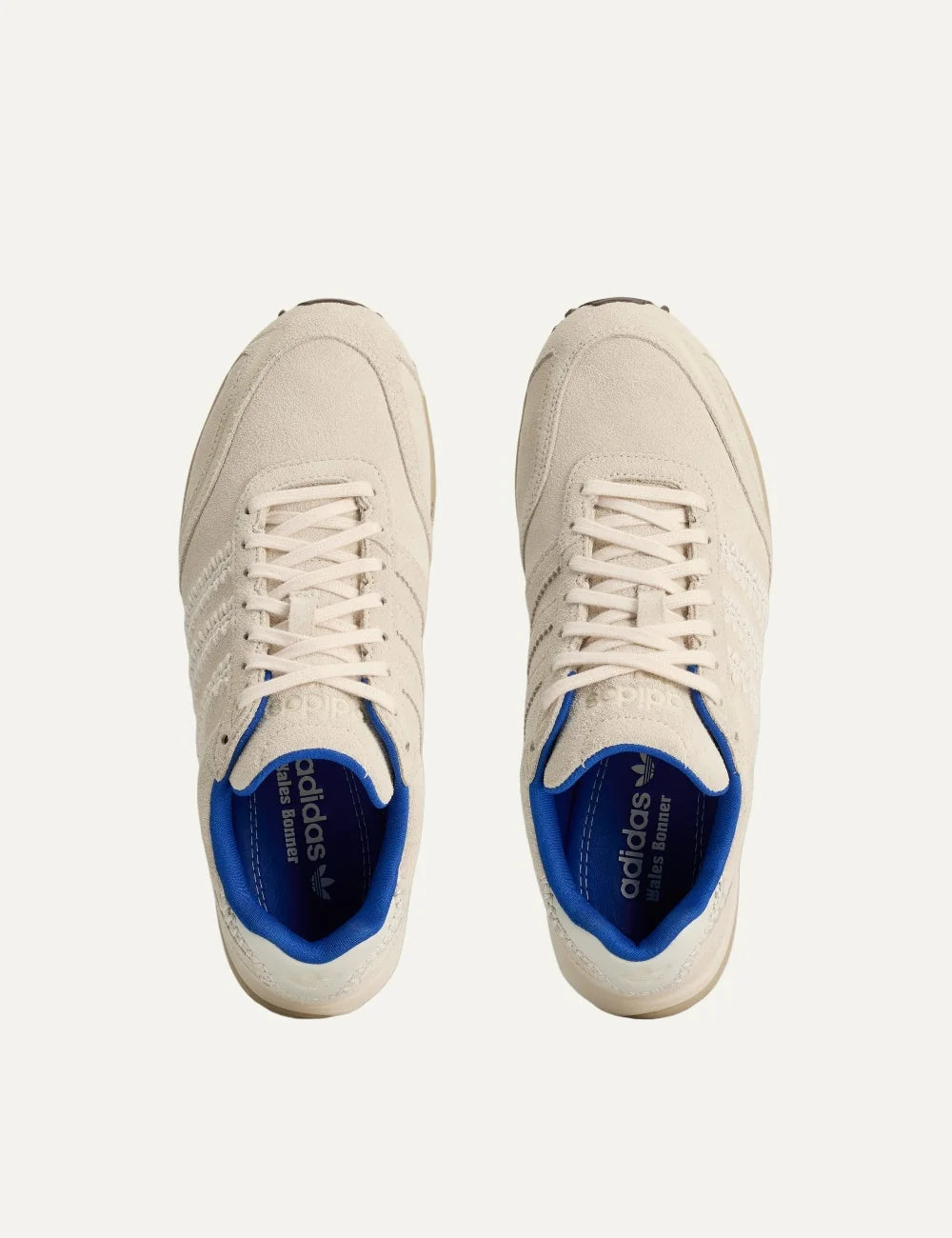 Unisex Adidas Originals x Wales Bonner Adizero Adios suede sneakers in wonder white with braided three stripes, blue accents and brown outsole, top view