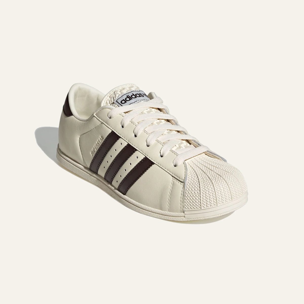 adidas Originals women Superstar Lo Pro cream white leather sneakers with Aurora Coffee stripes front angle view