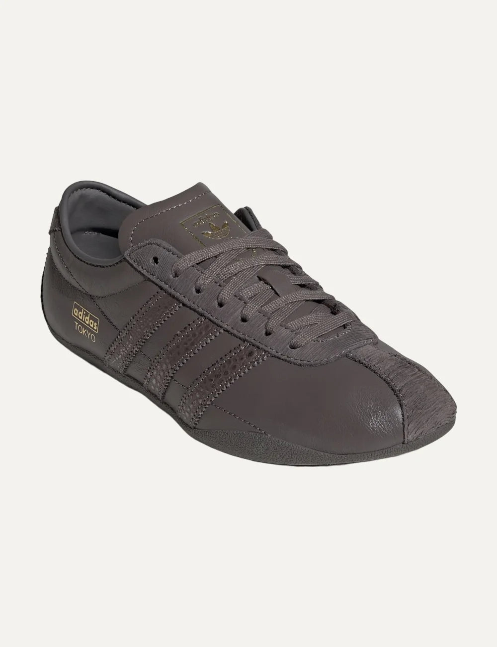 adidas Originals women Tokyo charcoal leather sneakers with textured stripes and gold logo angled