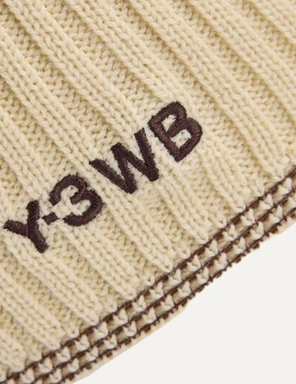 Adidas x Wales Bonner cream ribbed merino wool knit cap with curved peak, contrast stripe stitching and embroidered side logo detail