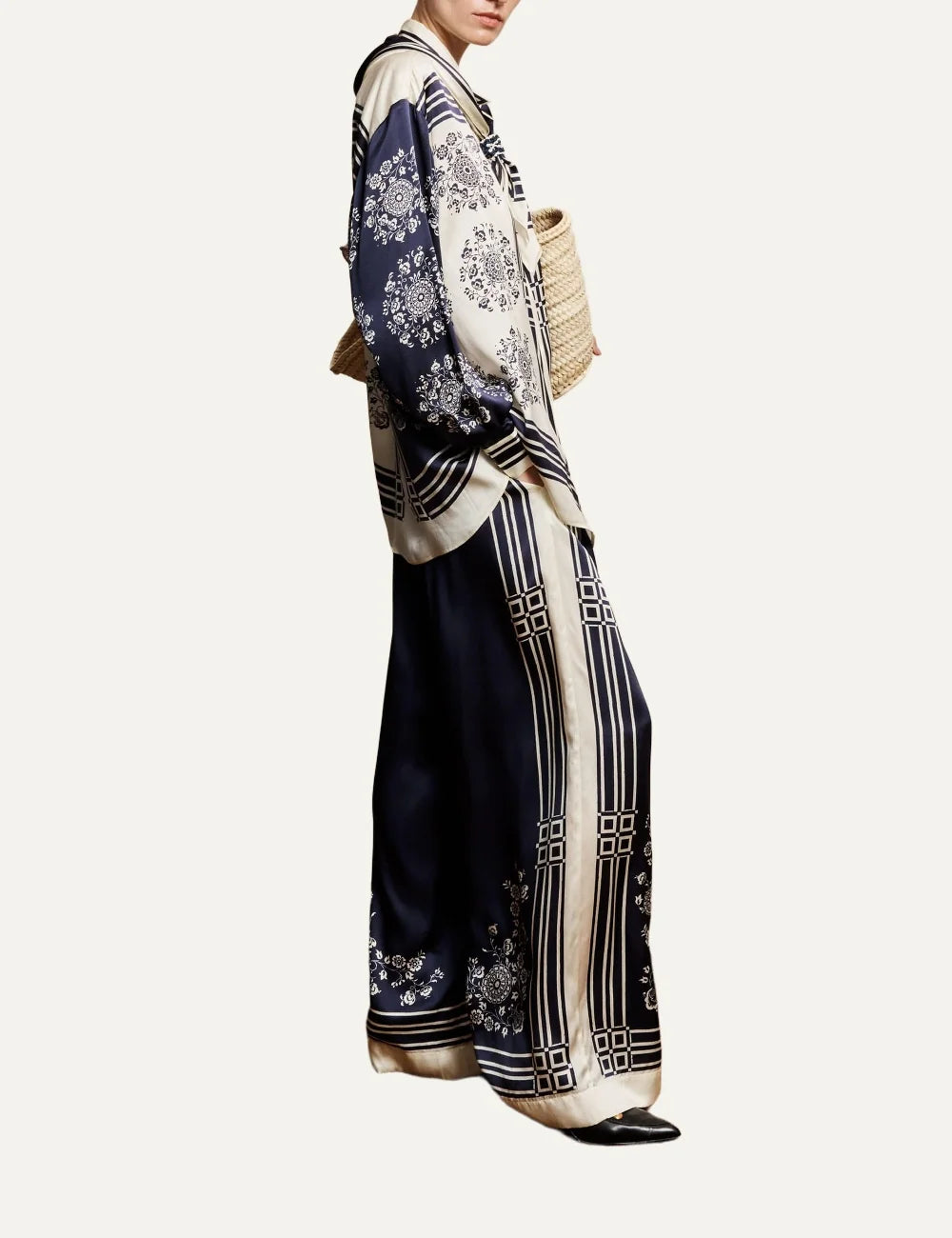 Alemais Banderra women's navy blue silk satin wide leg pants with cream floral print and striped borders at the hems side