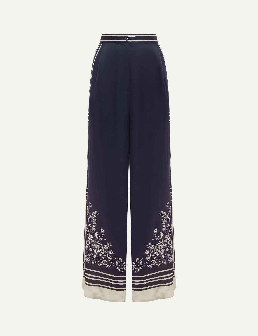 Alemais Banderra women's navy blue silk satin wide leg pants with cream floral print and striped borders at the hems.