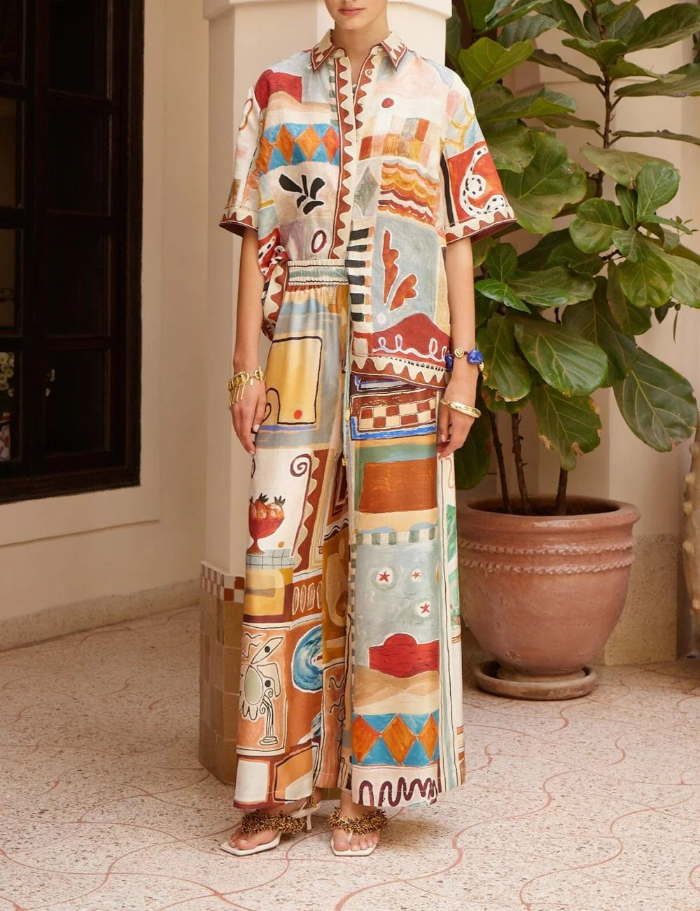 ALEMÁIS Michelle silk jogger pants worn on model, artistic multicolor print