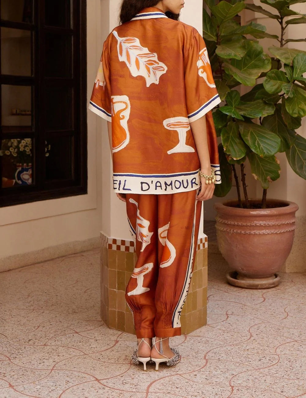 Alemais Soleil D’Amour silk trousers back view artistic print