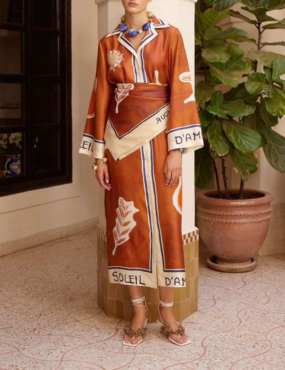 Alemais Soleil d’Amour silk scarf worn on model styled with dress