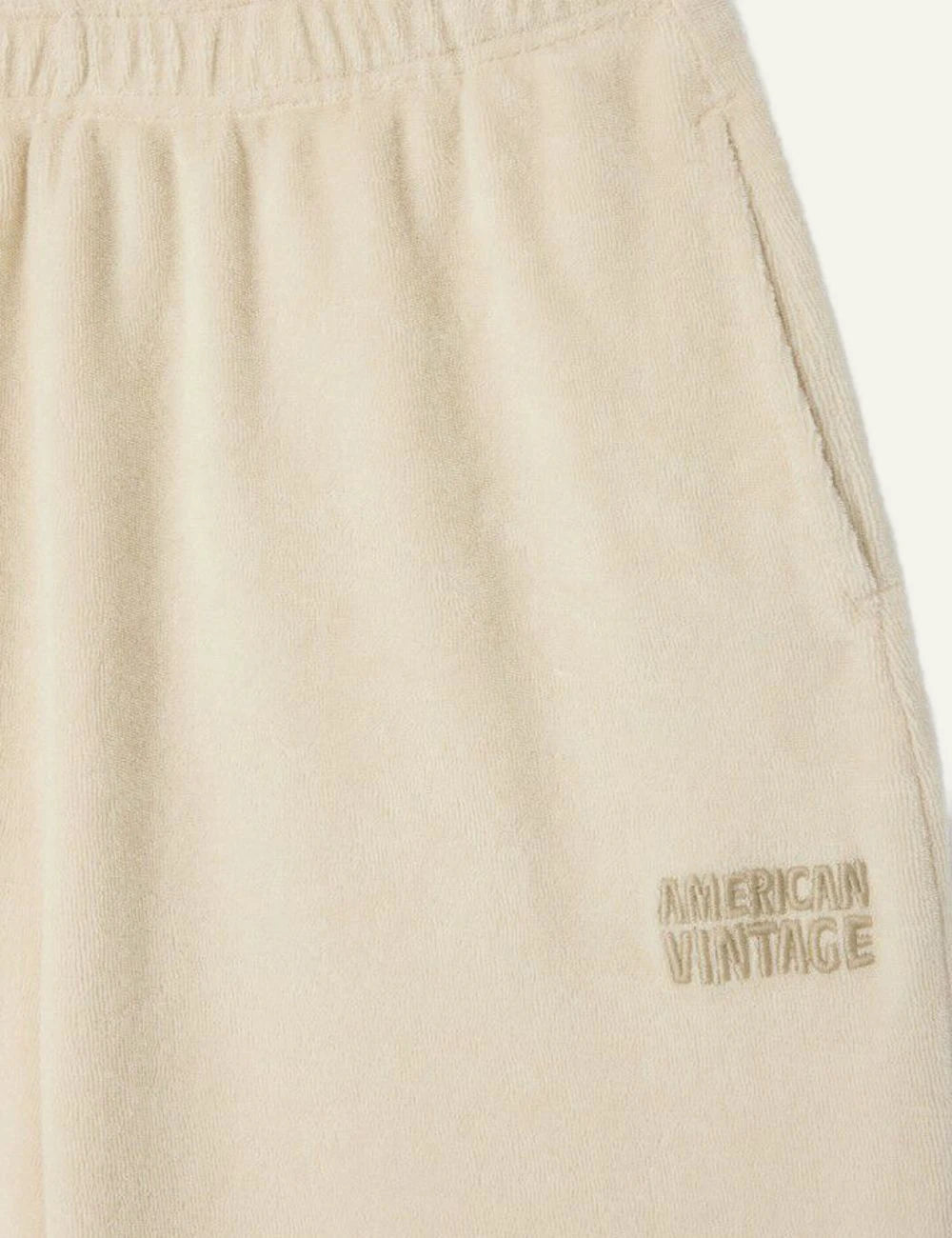 american vintage shorts beige elastic waist logo front logo detail view
