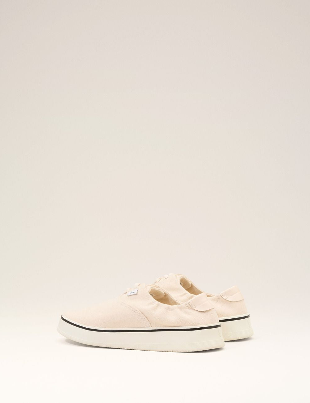 ami paris beige canvas tennis sneakers low top angled view