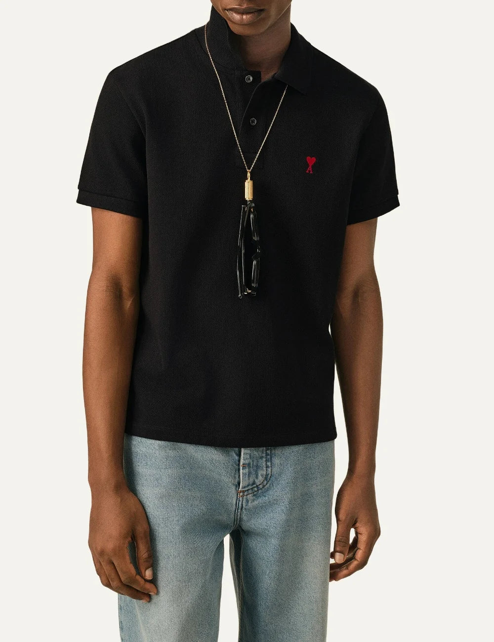 AMI Paris men black organic cotton polo shirt with red Ami de Coeur embroidery model