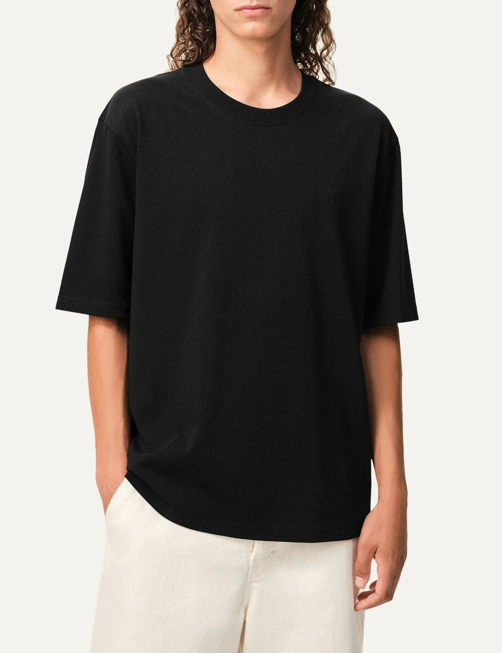 AMI Paris men black organic cotton T-shirt with tonal Ami de Coeur logo model