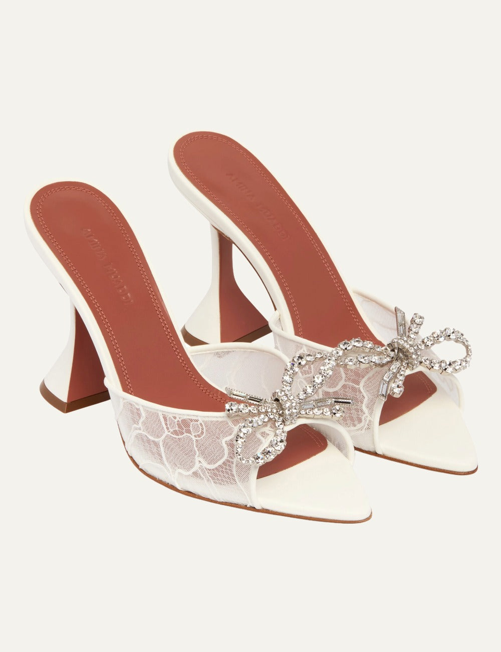 Amina Muaddi Rosie lace heels white crystal bow angled view