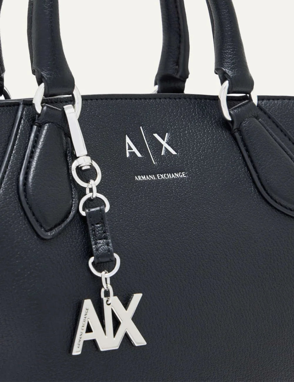 Women's Armani Exchange black handbag with double top handles, detachable shoulder strap, silver-tone A|X logo charm and zip closure detail