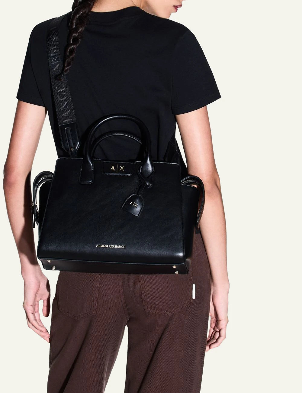armani exchange black top handle bag front model view