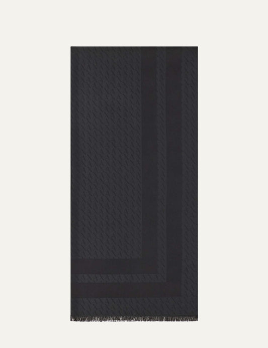 Armani Exchange women's black rectangular scarf with allover AX monogram pattern, tonal border stripes and fringed edges.