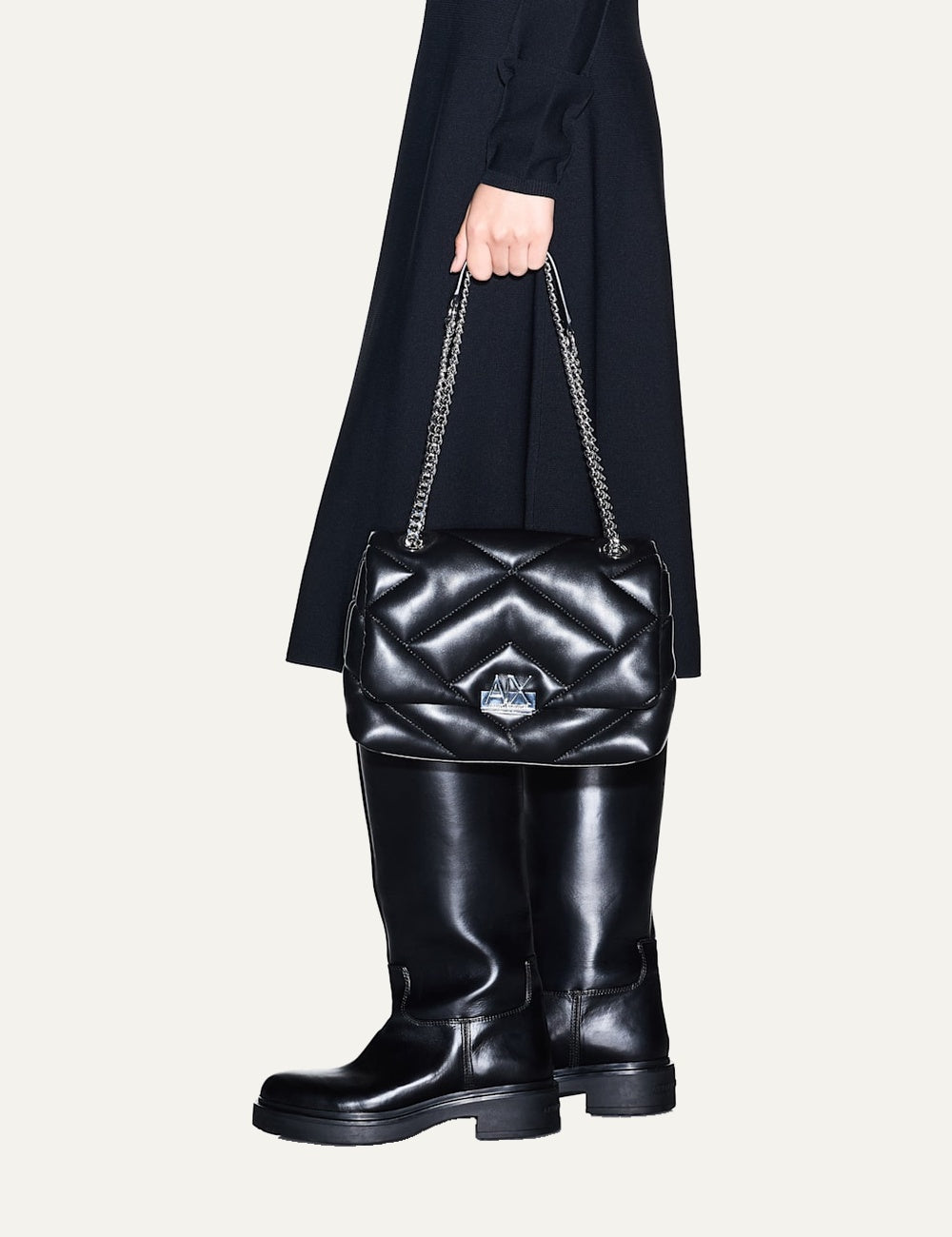 Armani Exchange women's black quilted crossbody bag with geometric stitching, silver-tone chain strap and metal A|X logo model