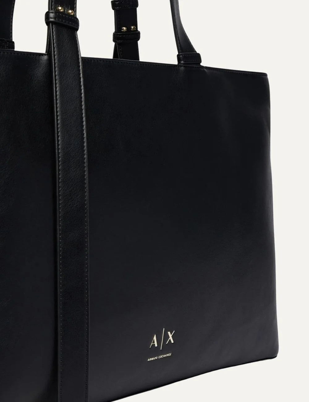 Women's Armani Exchange black tote bag with smooth coated finish, long adjustable handles, front strap detail and gold-tone A|X logo detail