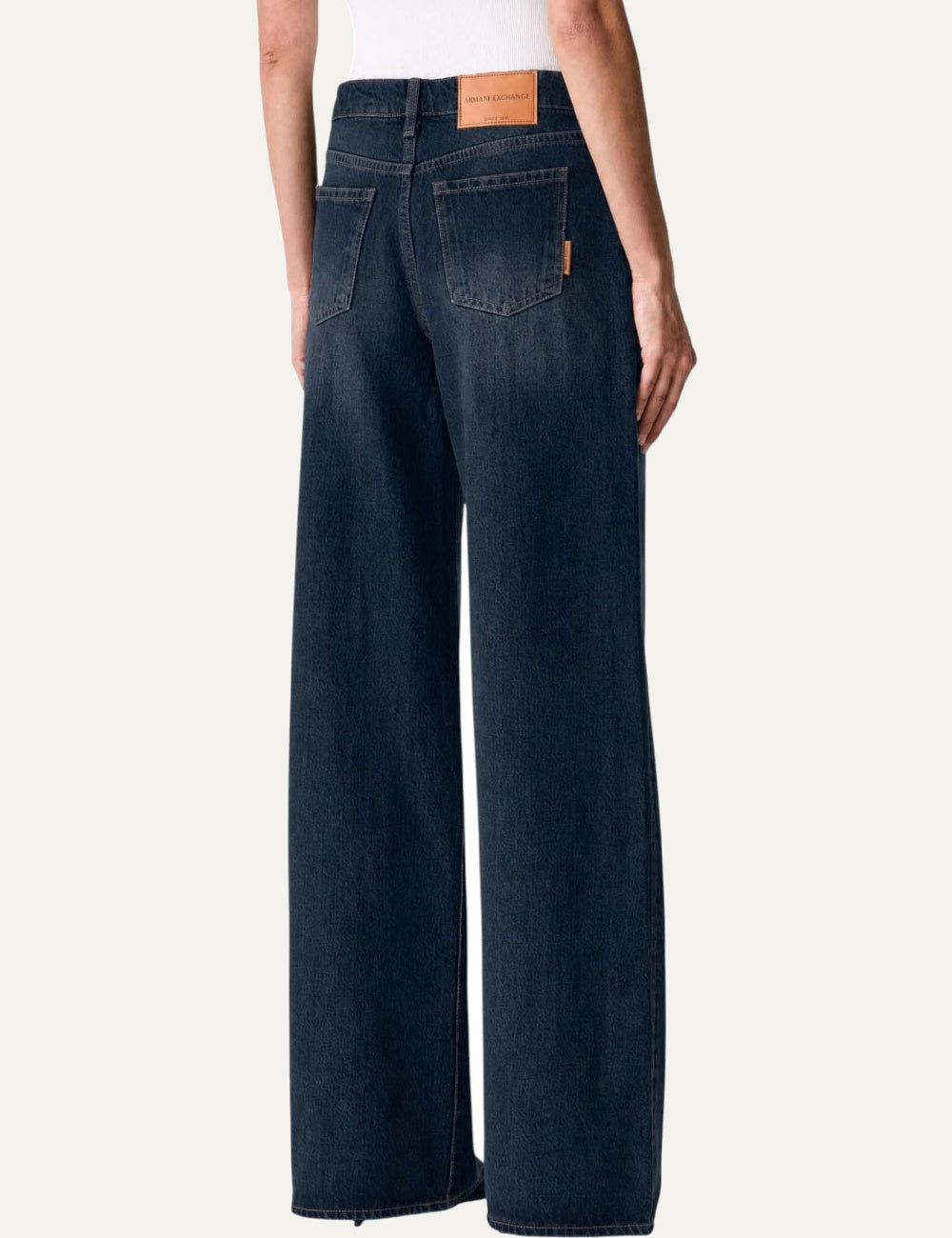Armani Exchange women's dark blue cotton jeans with low waist, wide legs, classic five-pocket design and subtle faded effect back