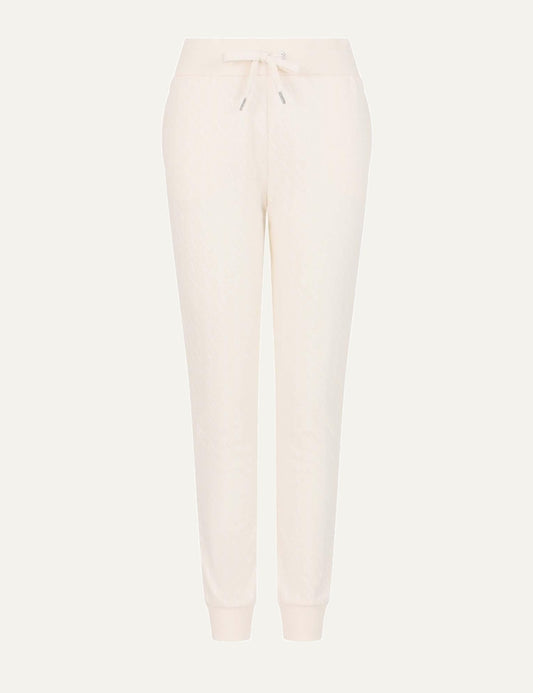 Armani Exchange women's ivory jogger pants with allover monogram pattern, elastic drawstring waist and ribbed cuffs.