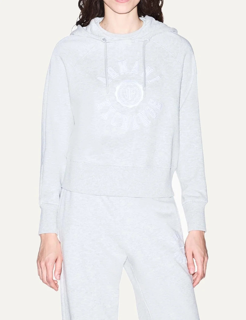 Armani Exchange women's light grey melange cotton hoodie with drawstring hood, embroidered front logo and ribbed cuffs model