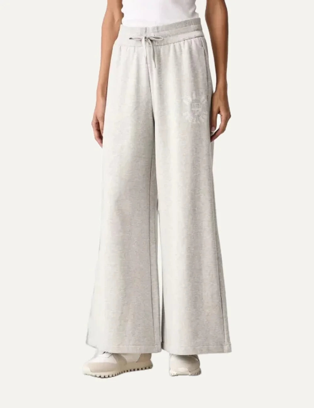 Armani Exchange women's light grey melange wide-leg sweatpants with elastic drawstring waist, side pockets and tonal logo.