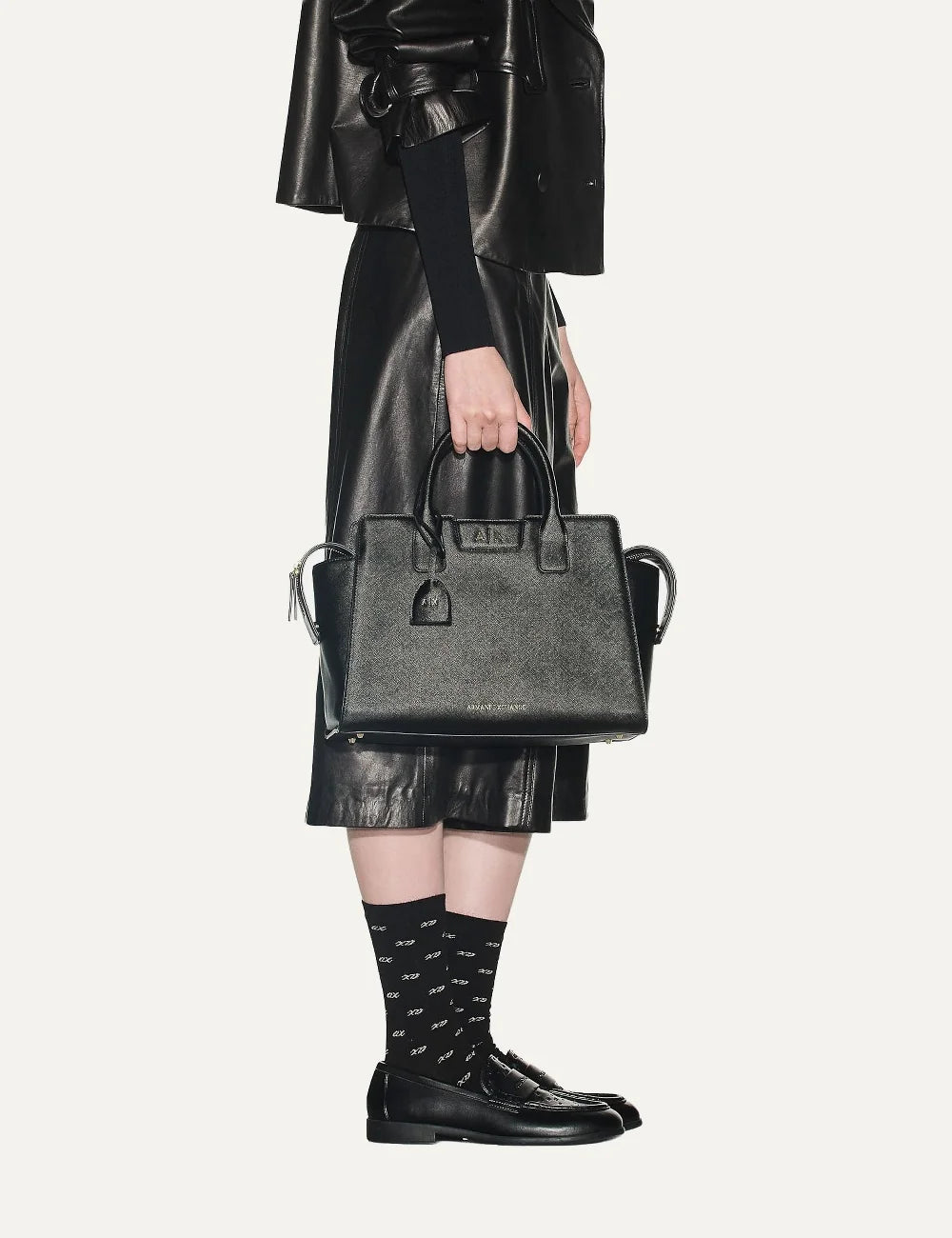 Women's Armani Exchange black Saffiano-effect structured handbag with top handles, removable shoulder strap, logo charm and metallic A|X logo model