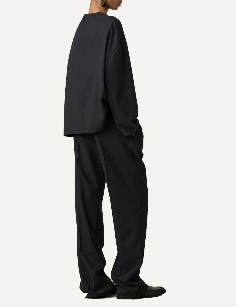 Armarium black relaxed fit wool trousers with elasticated waistband, front pleats and wide straight legs side