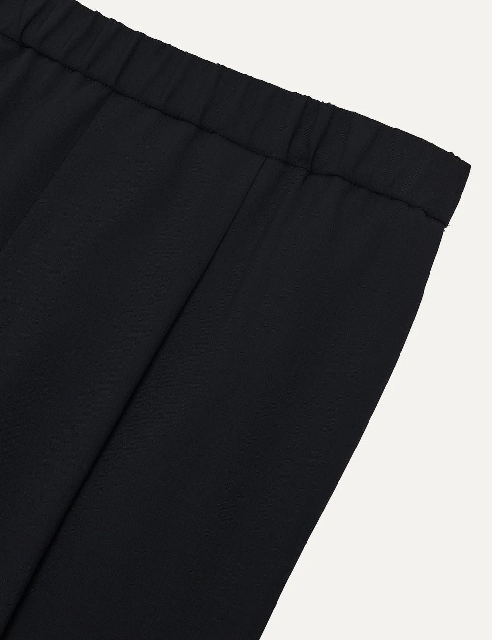 Armarium black relaxed fit wool trousers with elasticated waistband, front pleats and wide straight legs detail