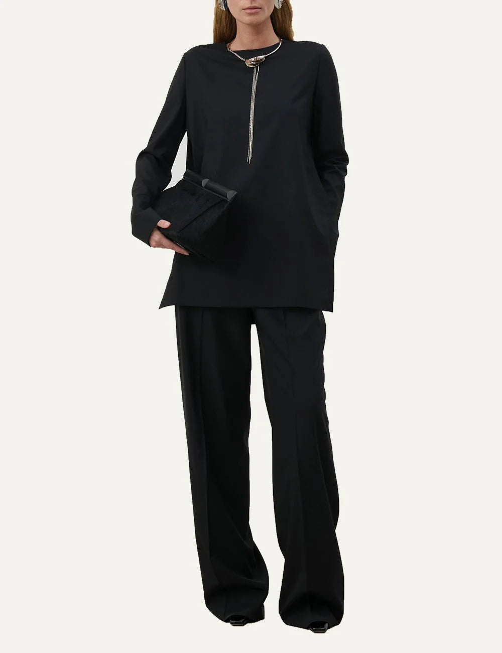 Armarium black lightweight wool long sleeve top with crew neckline, straight silhouette and deep side slits full body
