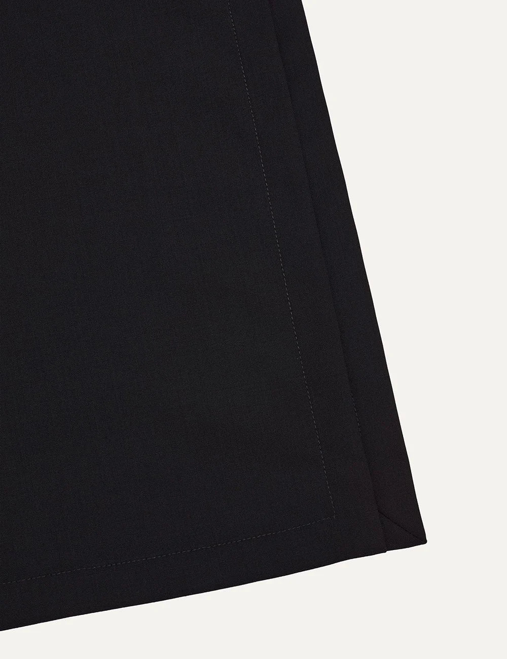 Armarium black lightweight wool long sleeve top with crew neckline, straight silhouette and deep side slits detail