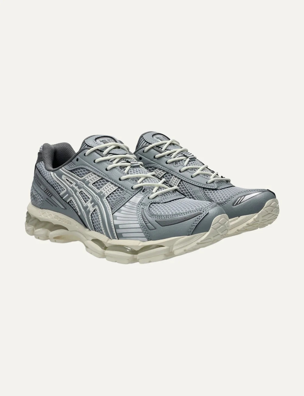 ASICS x KITH GEL-KAYANO 12.1 women's grey and off-white sneakers with mesh and metallic details angled