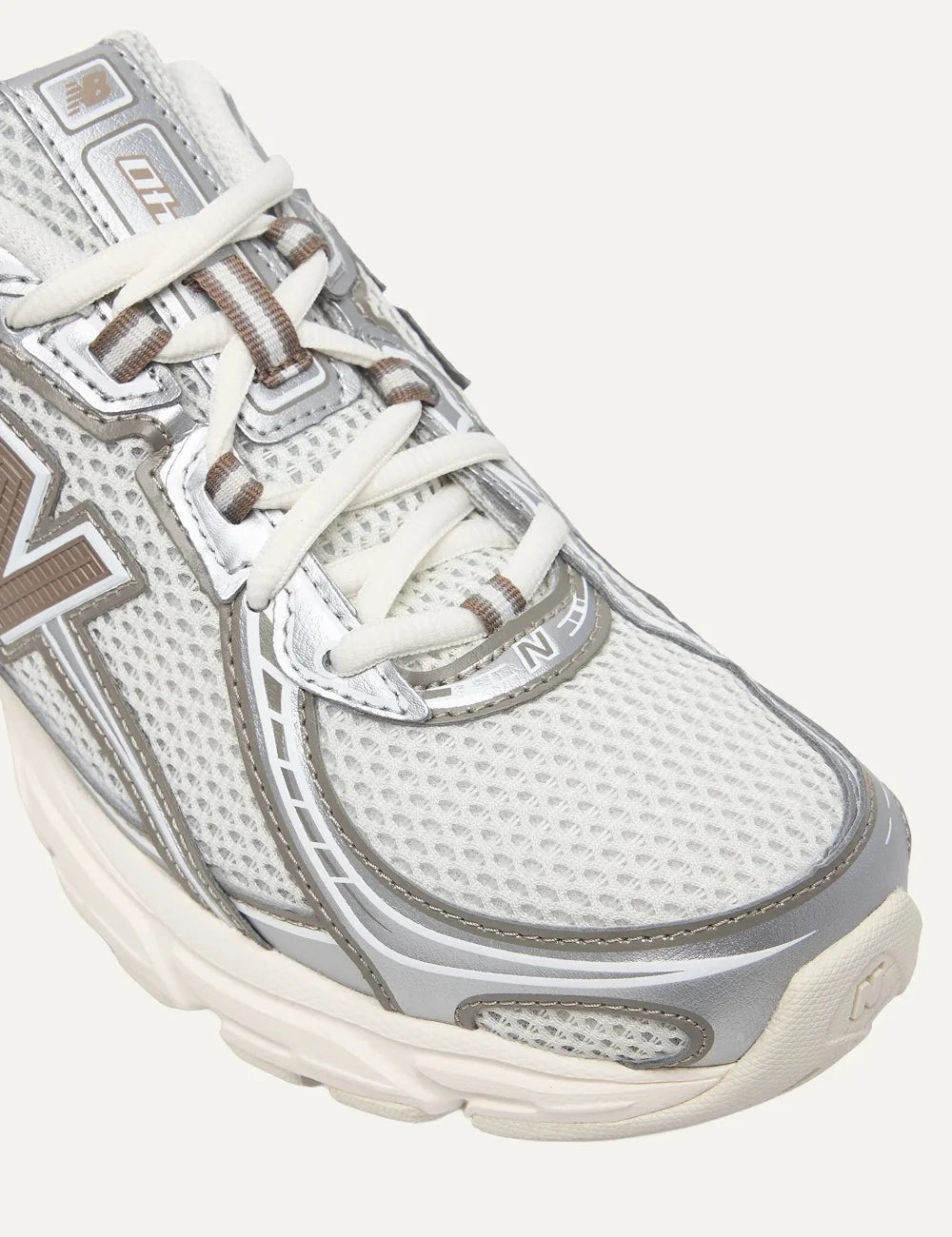 New Balance unisex cream grey mesh sneakers angled