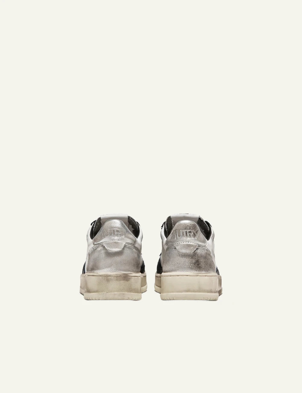 Autry low sneaker white black leather silver heel back pair view