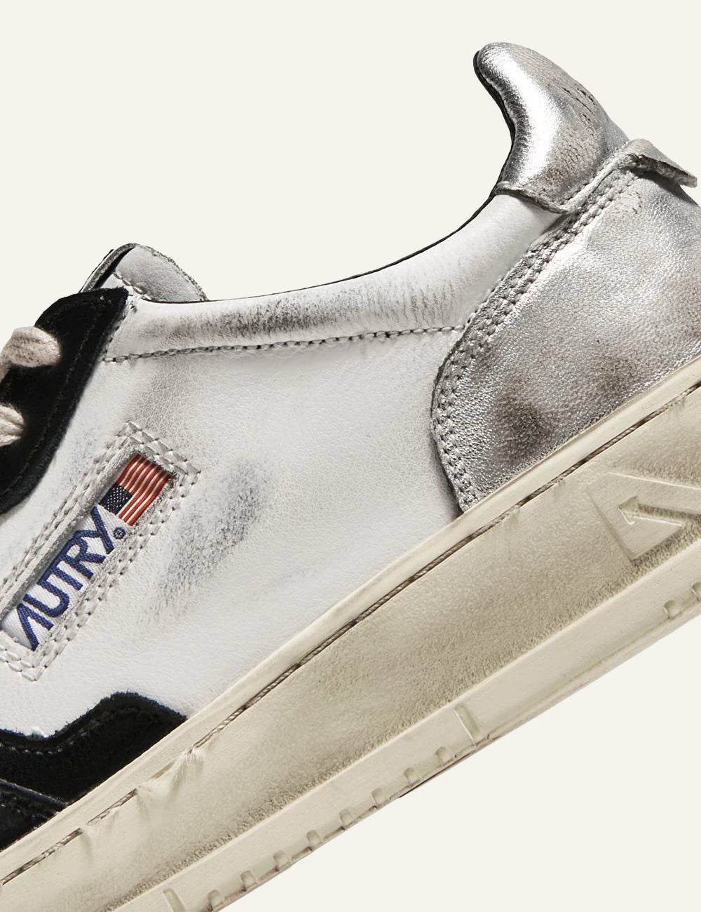 Autry low sneaker white black leather silver heel side angle