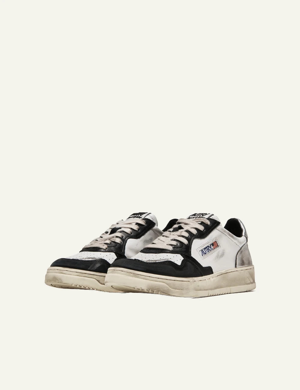 Autry low sneaker white black leather silver heel side pair view