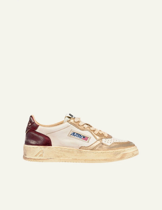 Autry Medalist Low Super Vintage sneakers white gold red detail side view