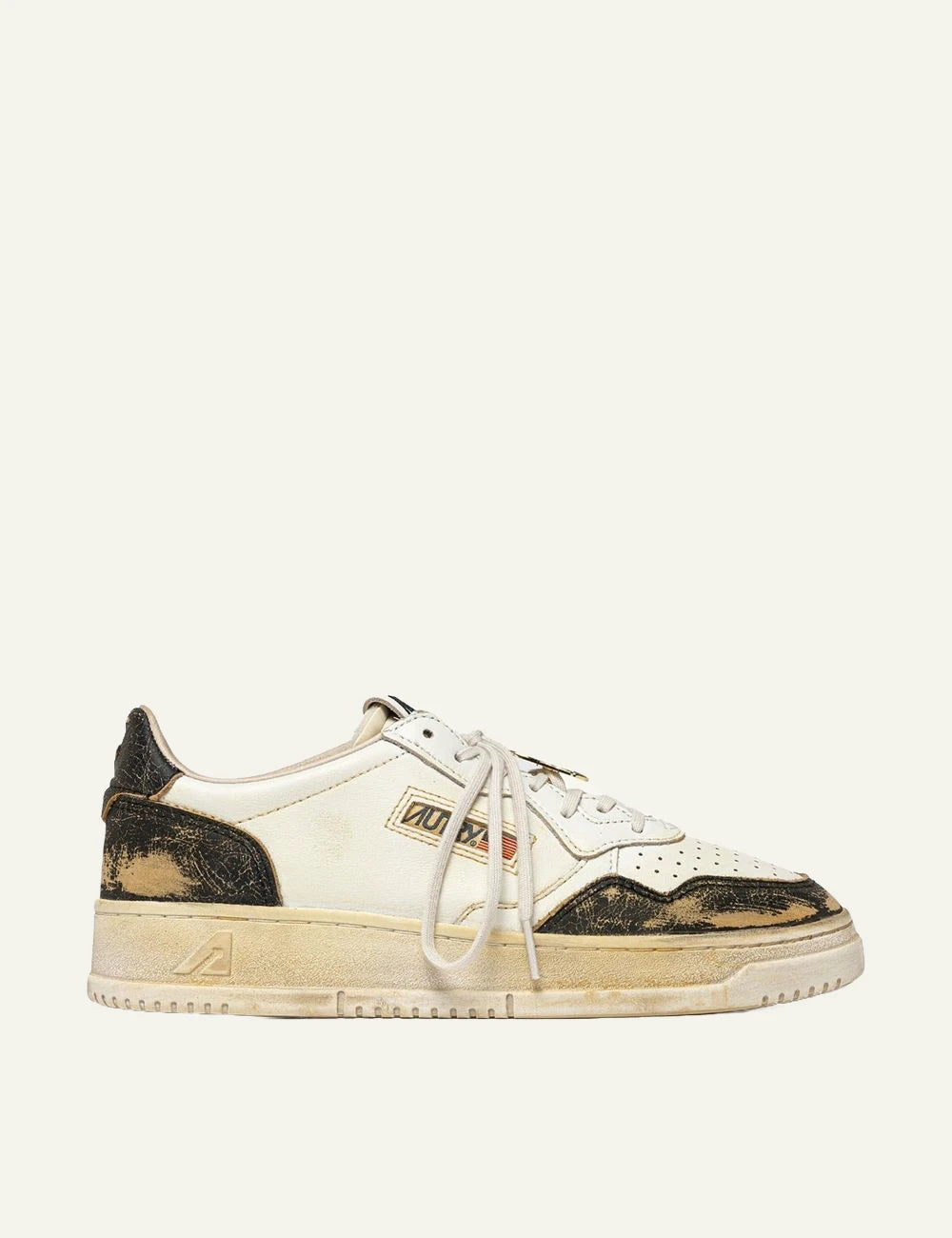 Autry men’s white and black leather sneakers with distressed vintage finish
