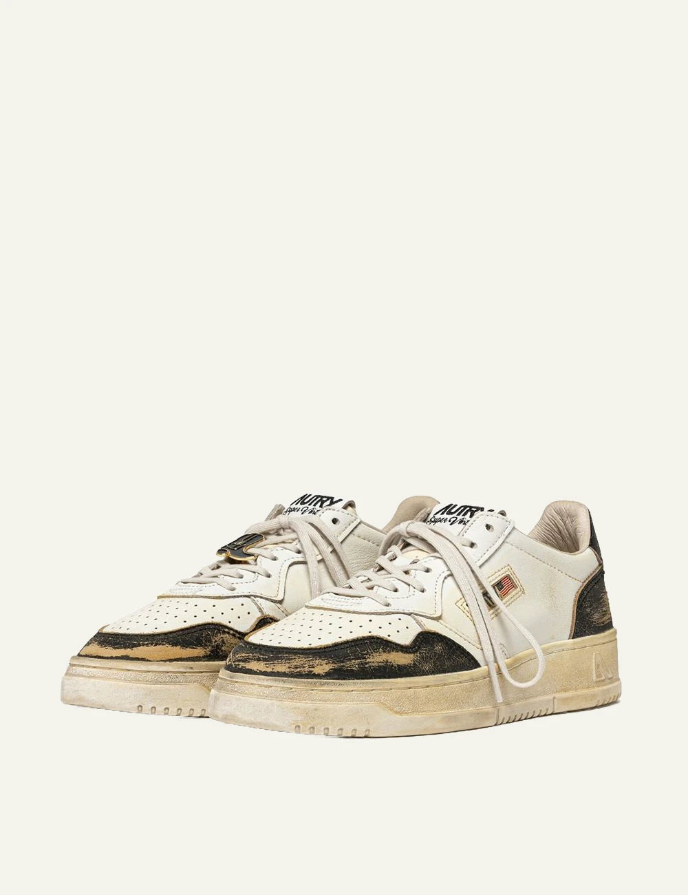 Autry men’s white and black leather sneakers with distressed vintage finish profile