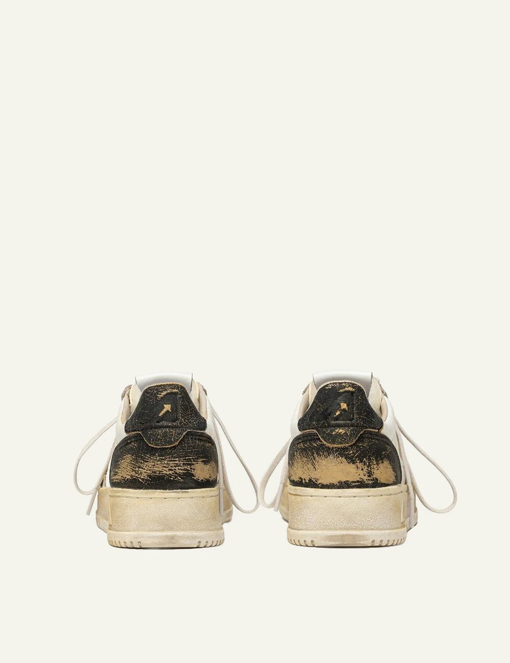Autry men’s white and black leather sneakers with distressed vintage finish back