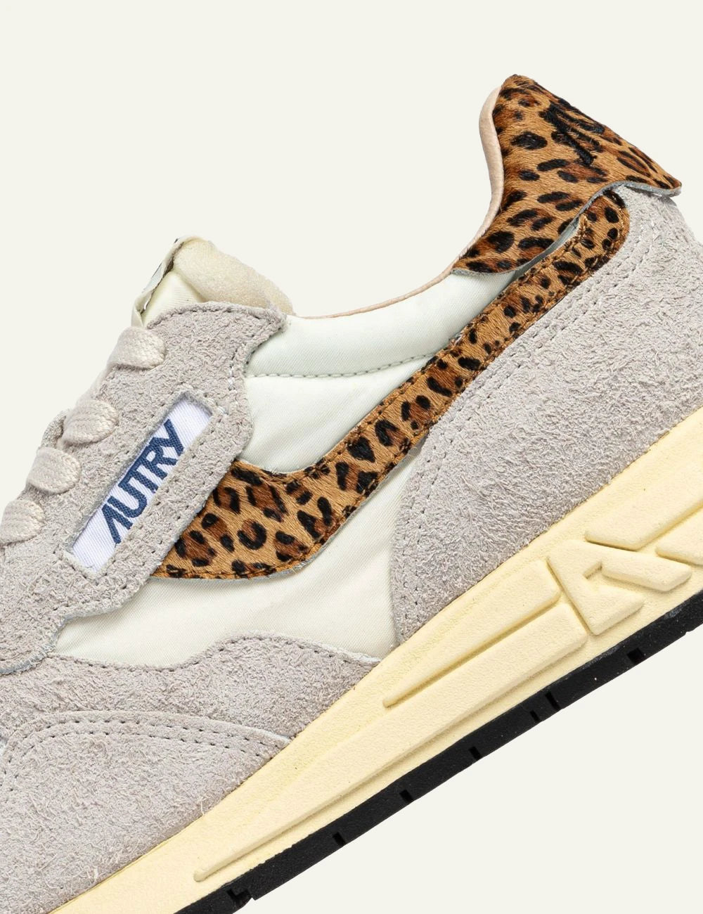 Autry women’s Reelwind Low white suede and mesh sneakers with leopard-print details close up details