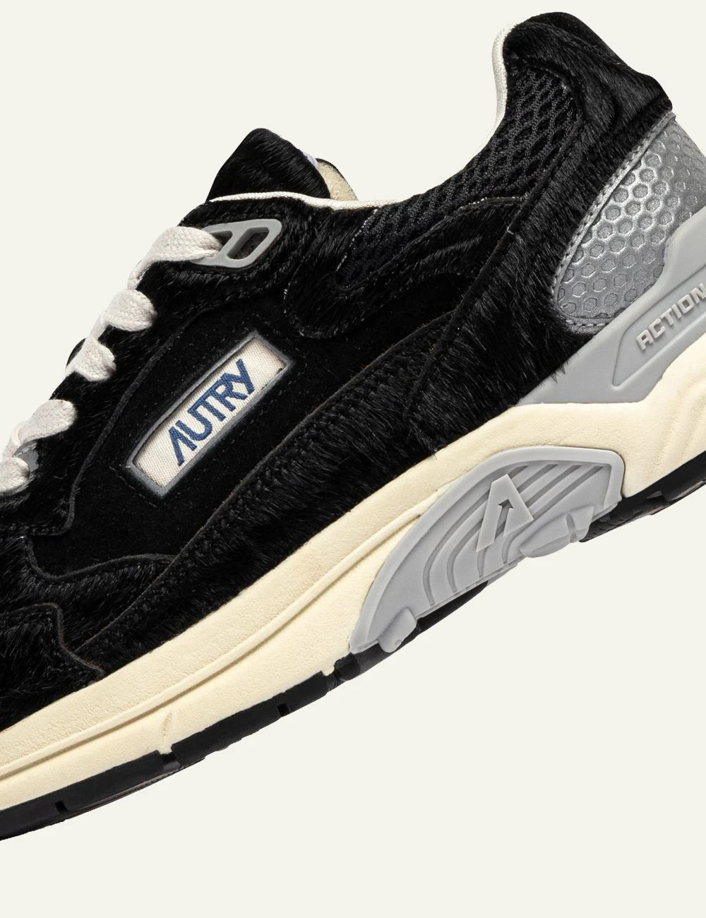 Autry women's black Hyperway pony effect suede and mesh sneakers logo