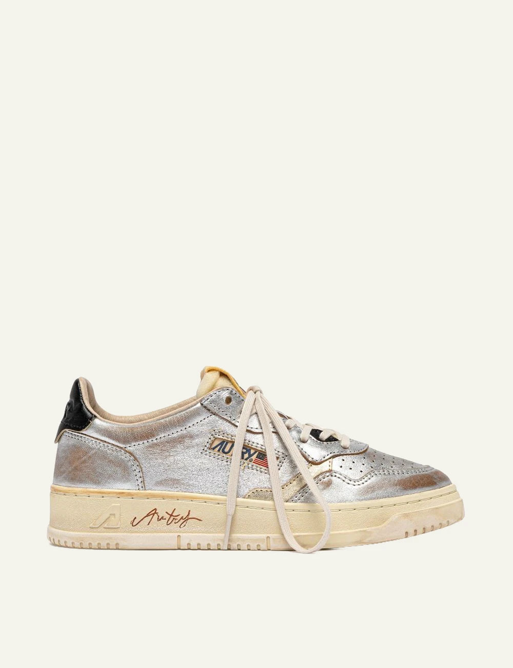 Autry women’s metallic silver leather sneakers with vintage finish
