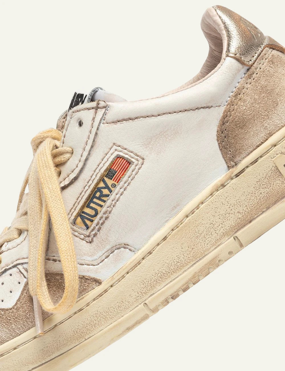 Autry Women’s Vintage White Leather And Beige Suede Sneakers With Gold Details logo
