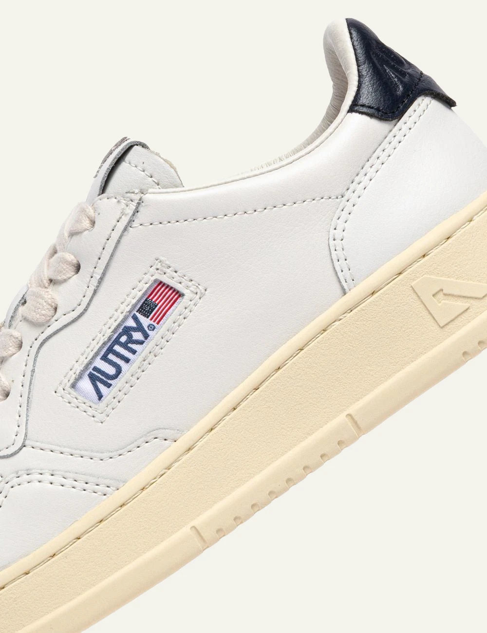 Autry women’s white leather sneakers with blue heel detail logo